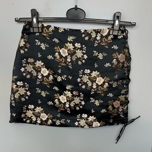 Fashion Nova Black & Gold Floral Mini Skirt with Side Tie Detail